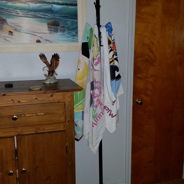 Hang wet towels on a coat rack